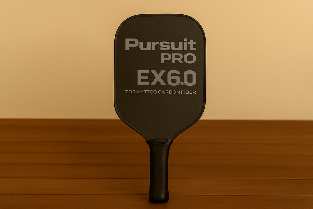 Engage Pursuit Pro EX6.0 paddle standing upright on wooden surface.