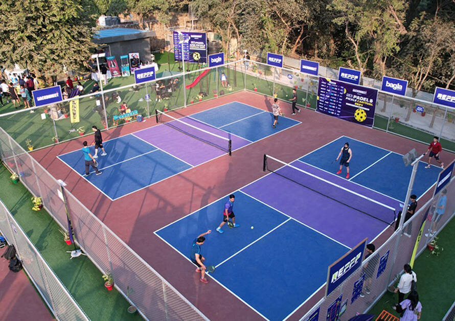 Pickleball players enjoying matches on outdoor courts during a community event